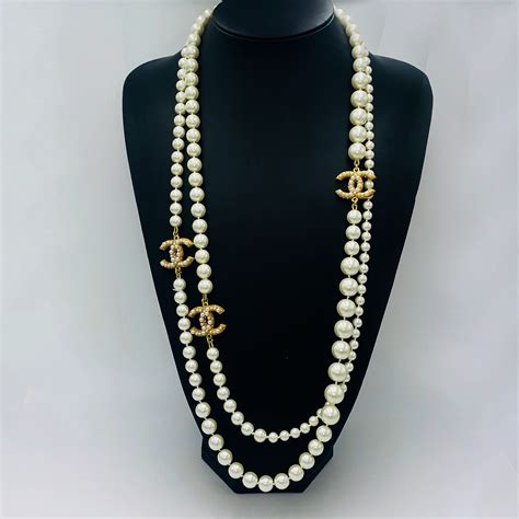 cheap chanel logo necklaces|chanel pearl long strand necklaces.